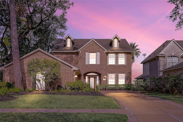 view of front of house with a yard