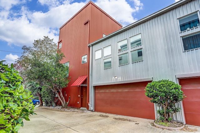 view of side of home with a garage