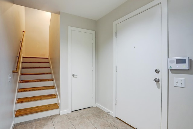 entrance foyer with light tile patterned floors