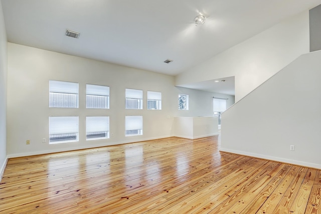 empty room featuring light hardwood / wood-style flooring and plenty of natural light