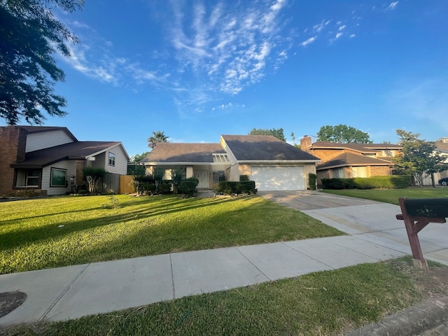 ranch-style house featuring a garage and a front lawn