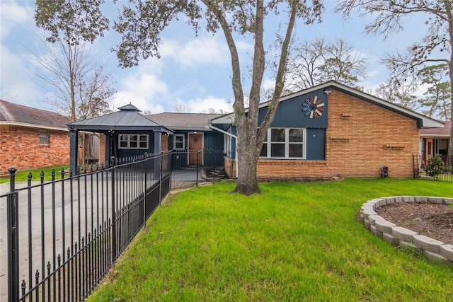 mid-century modern home featuring brick siding, a gazebo, a front lawn, and fence