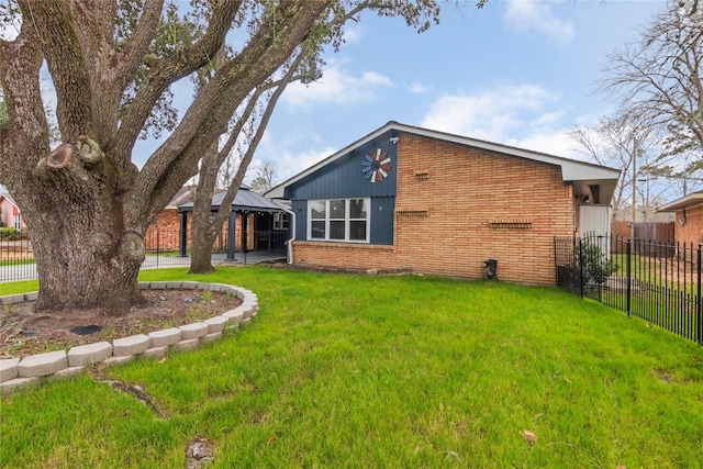 back of property with brick siding, fence, a gazebo, a lawn, and a patio area