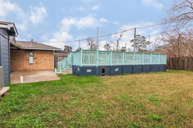 view of yard featuring a patio and fence