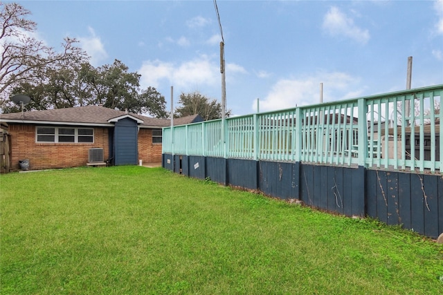 view of yard featuring central AC unit