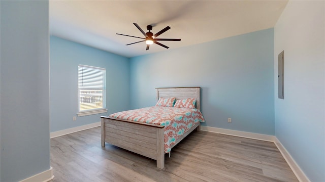 bedroom with ceiling fan and light wood-type flooring