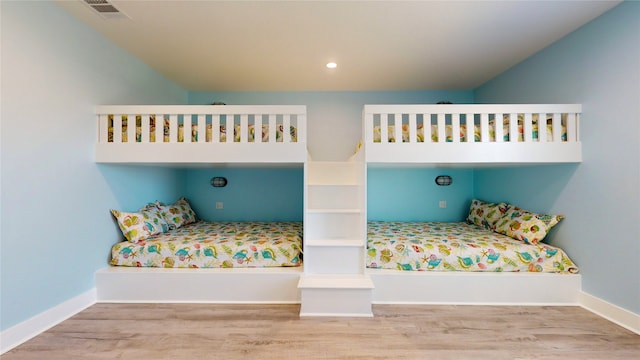 unfurnished bedroom with light wood-type flooring