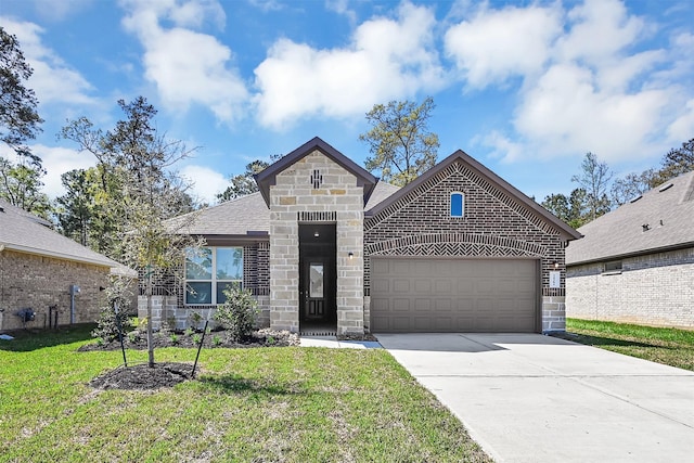 view of front of home featuring a garage and a front lawn