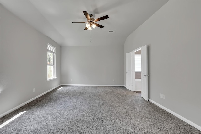 carpeted spare room featuring ceiling fan