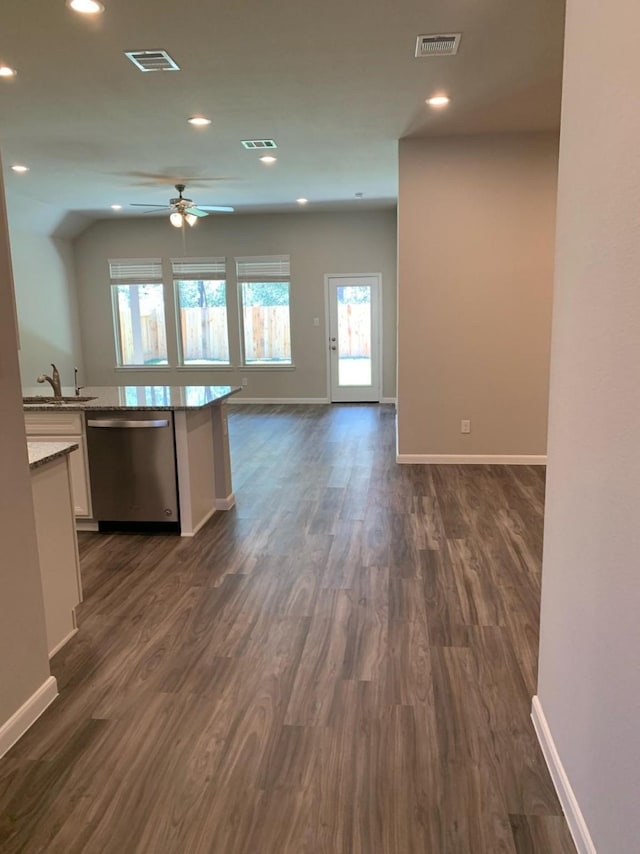 kitchen with dishwasher, sink, dark hardwood / wood-style floors, ceiling fan, and white cabinetry