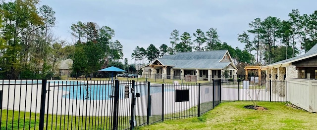 view of pool featuring a yard