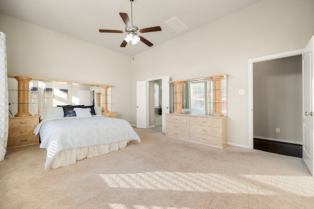 bedroom featuring ceiling fan, high vaulted ceiling, and light colored carpet