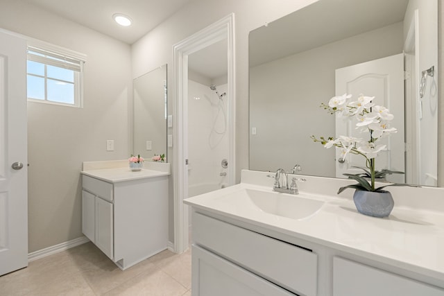 bathroom with tile patterned floors, vanity, and  shower combination