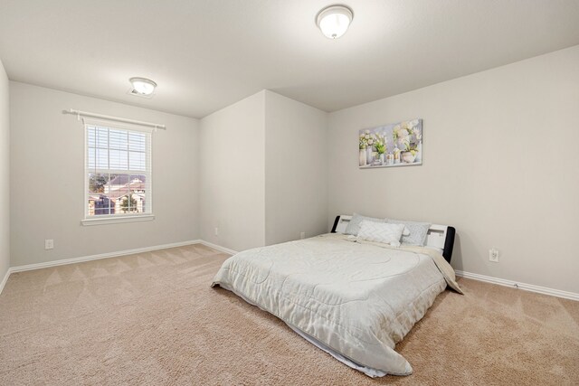 bedroom with light carpet