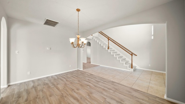 interior space featuring a notable chandelier and light hardwood / wood-style floors