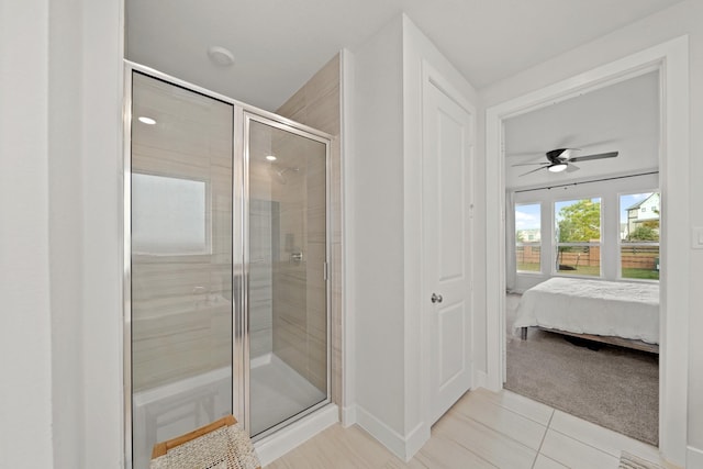 bathroom with ceiling fan, tile patterned floors, and walk in shower