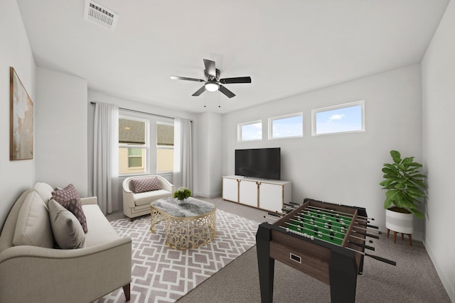 carpeted living room featuring ceiling fan