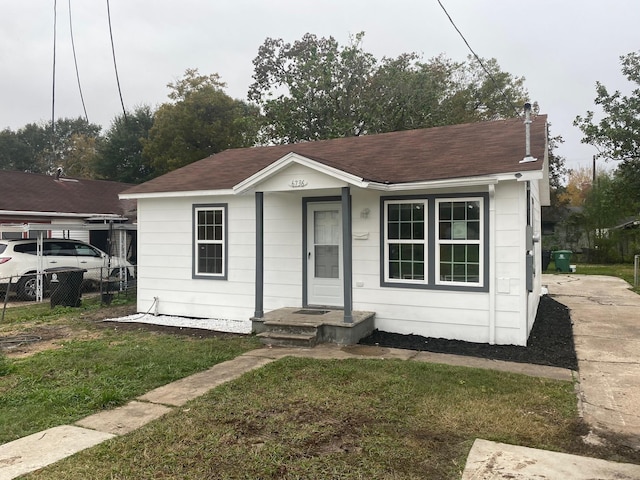 bungalow with a front lawn