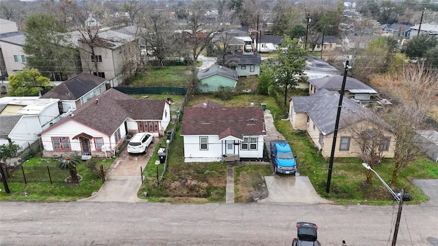 birds eye view of property with a residential view