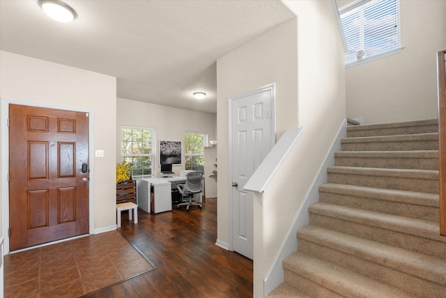 entrance foyer with dark hardwood / wood-style floors