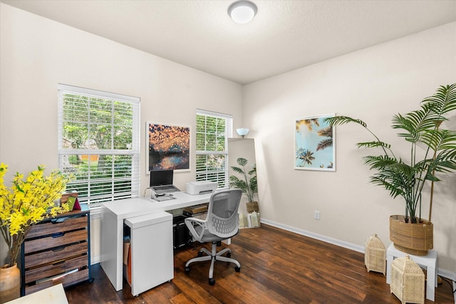 home office with dark wood-type flooring