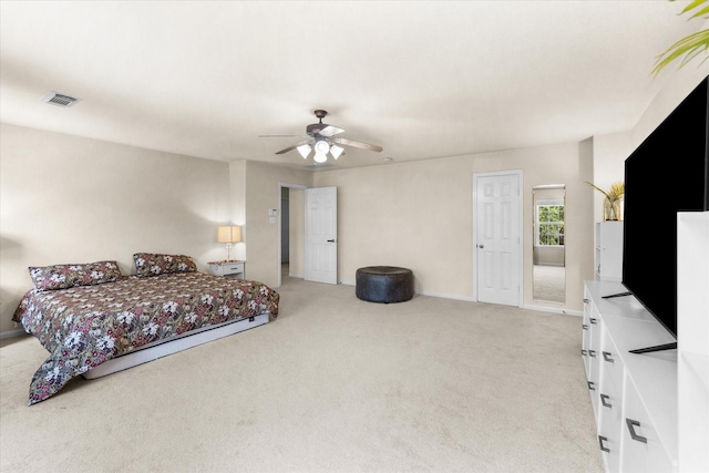 bedroom with ceiling fan and light colored carpet