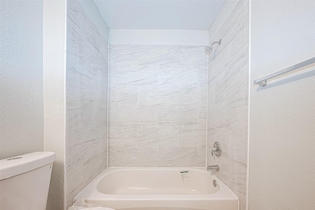 bathroom with shower / tub combination and toilet