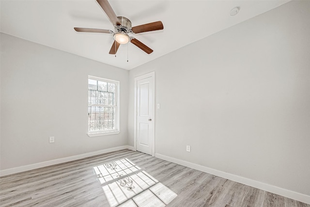 unfurnished room with ceiling fan and light wood-type flooring