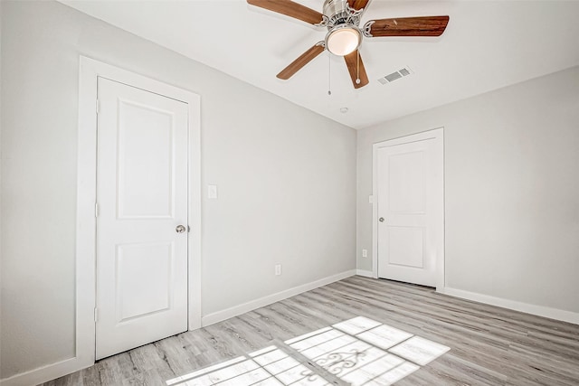 unfurnished bedroom featuring light hardwood / wood-style flooring and ceiling fan