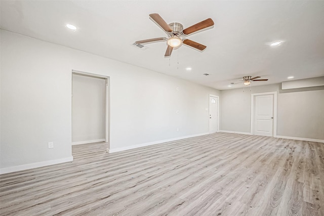 unfurnished room featuring light hardwood / wood-style flooring and ceiling fan