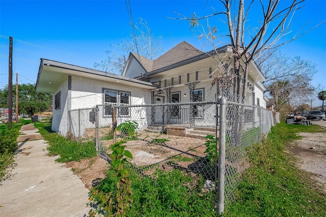 rear view of property featuring covered porch