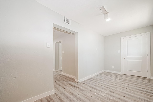 spare room with light hardwood / wood-style floors