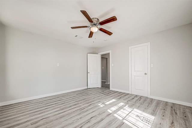 unfurnished bedroom with ceiling fan, light hardwood / wood-style floors, and a closet