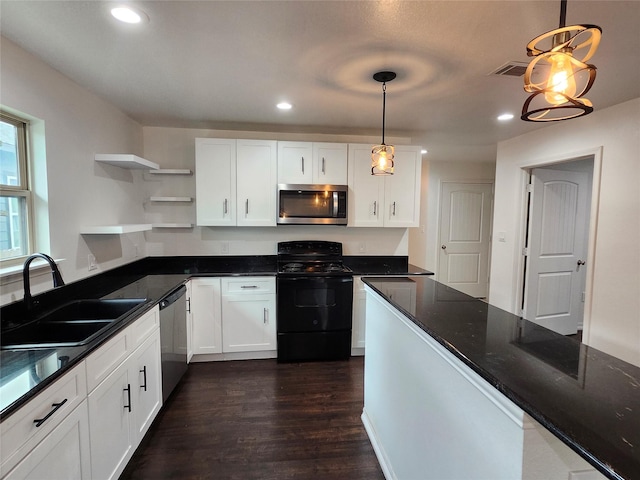 kitchen with sink, hanging light fixtures, stainless steel appliances, dark stone counters, and white cabinets