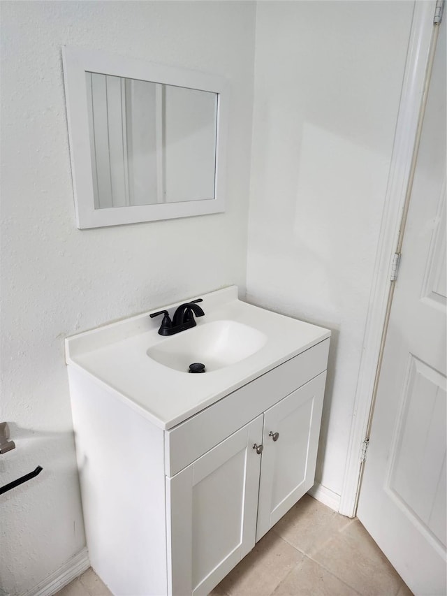 bathroom with tile patterned flooring and vanity