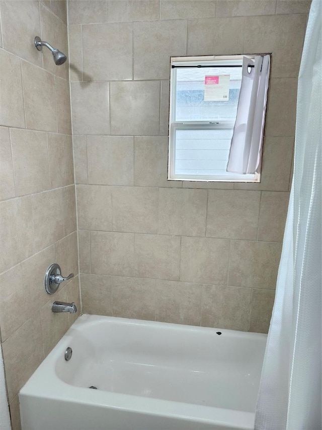 bathroom featuring shower / bath combination with curtain