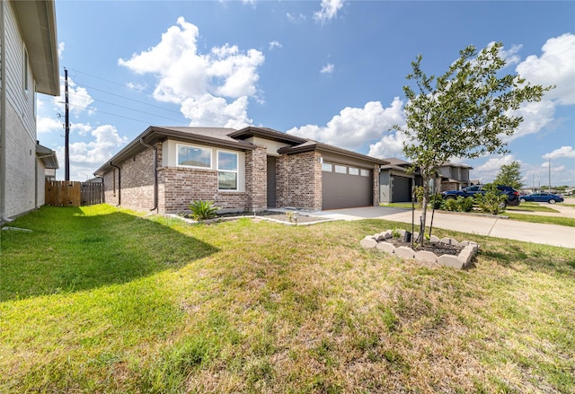 view of front of property featuring a garage and a front lawn