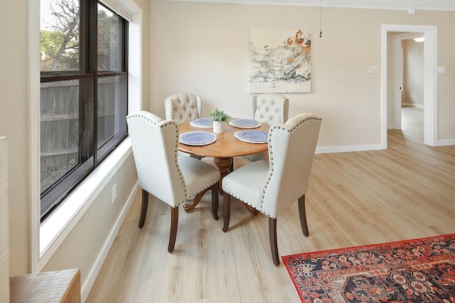 dining space with light hardwood / wood-style floors