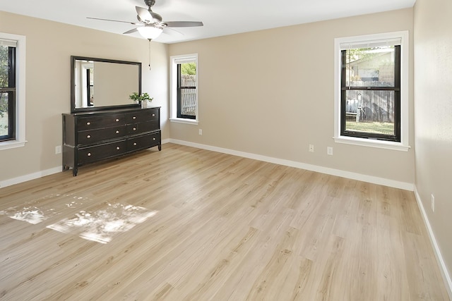 unfurnished bedroom with light hardwood / wood-style flooring and ceiling fan