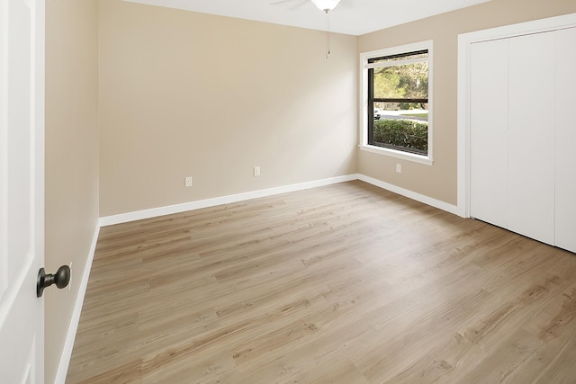 unfurnished bedroom with light wood-type flooring