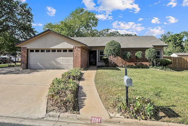 single story home with a garage and a front lawn