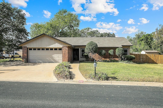 ranch-style home featuring a front yard and a garage