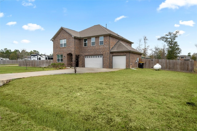 view of front of property featuring a garage and a front lawn