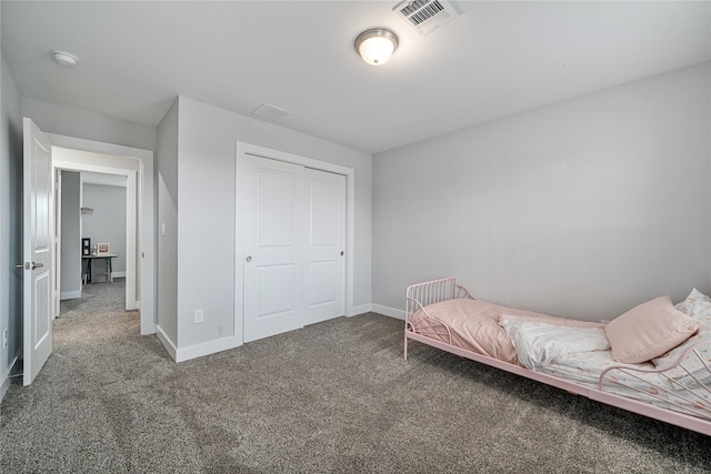 bedroom with carpet floors and a closet