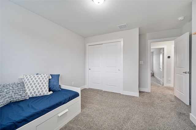 bedroom featuring a closet and carpet