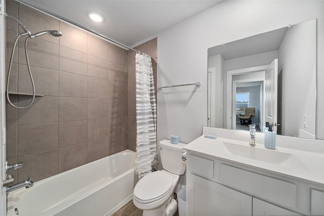 full bathroom featuring vanity, toilet, and shower / bathtub combination with curtain