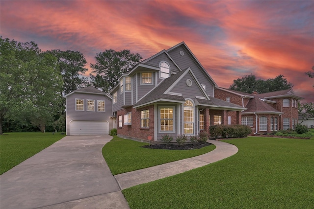 view of front facade featuring a garage and a yard