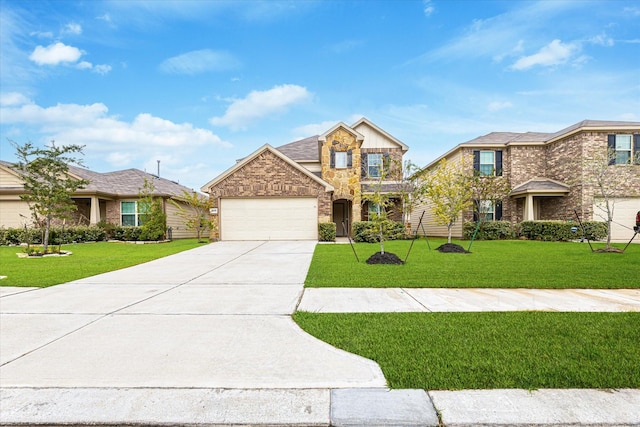 view of front of home featuring a front yard and a garage