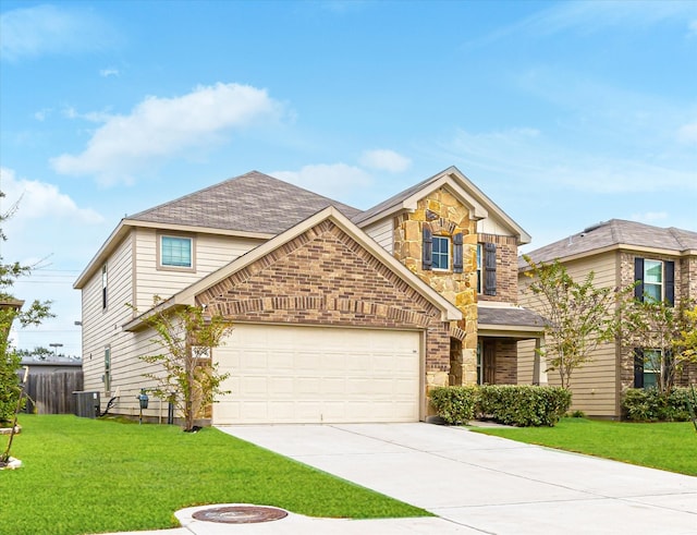 view of front of house featuring a garage, central air condition unit, and a front lawn