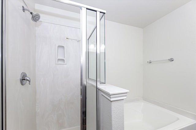 bathroom with separate shower and tub